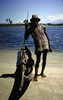 His clothes are made from plastic bags. Not bad!